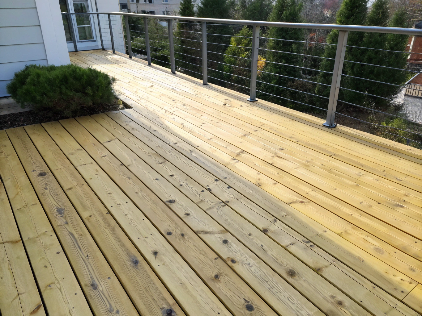 Restored natural wood timber deck after power washing treatment